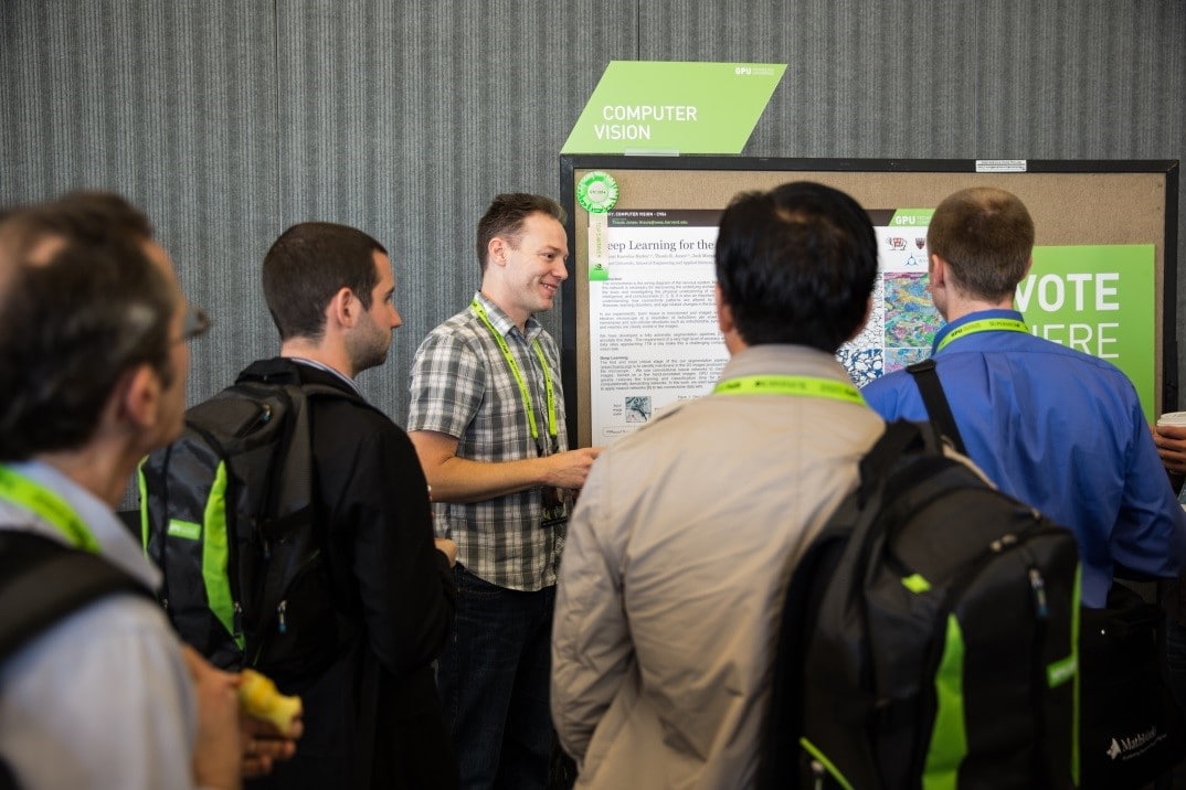 A presenter at the Posters & Beer reception makes his case to be voted poster of the year—and take home a $5,000 check.