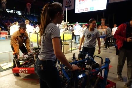 All-girl team Space Cookies move their robot between heats.