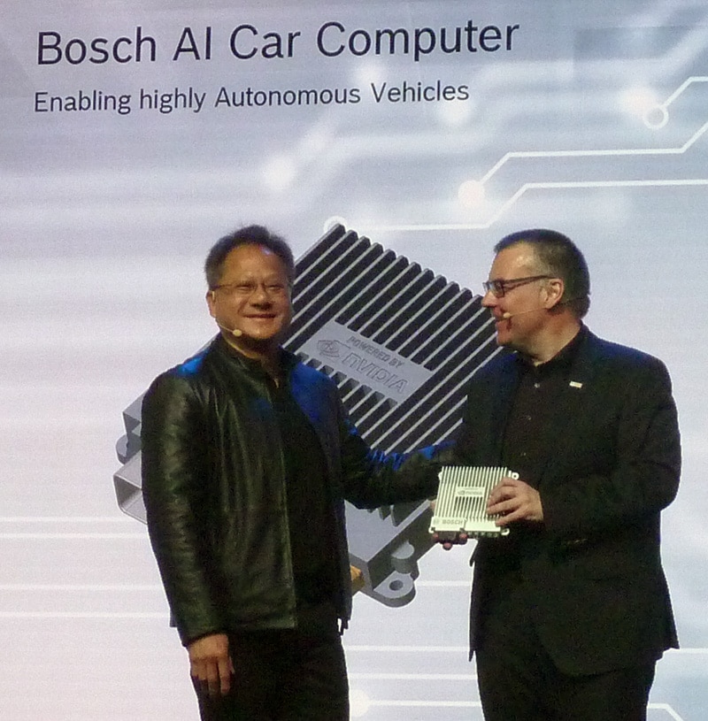 NVIDIA CEO Jen-Hsun Huang and Bosch executive Dr. Dirk Hoheisel with Bosch AI Car Computer