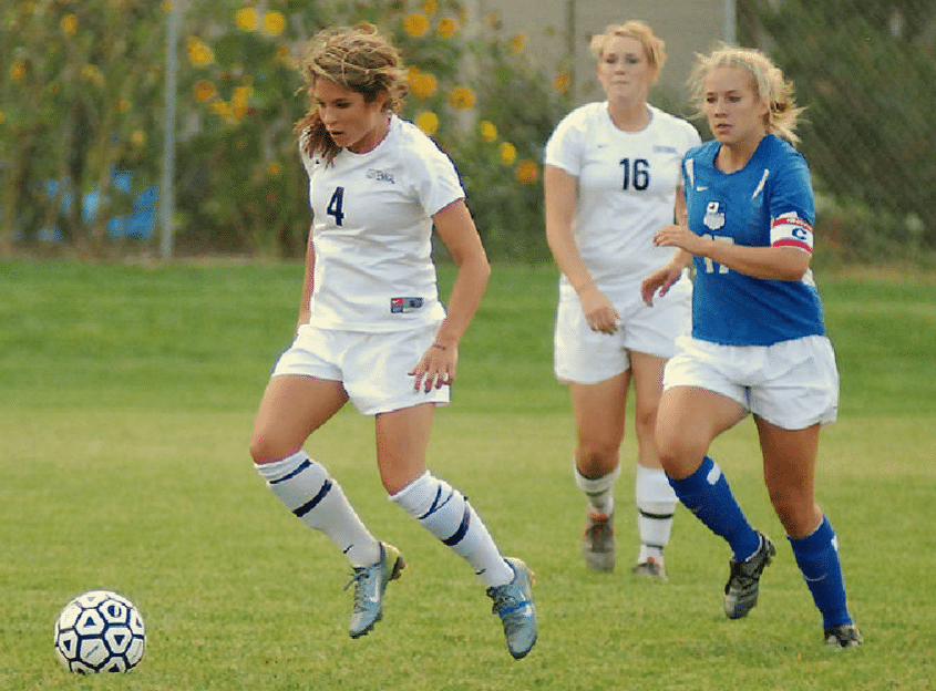 Girls playing soccer.