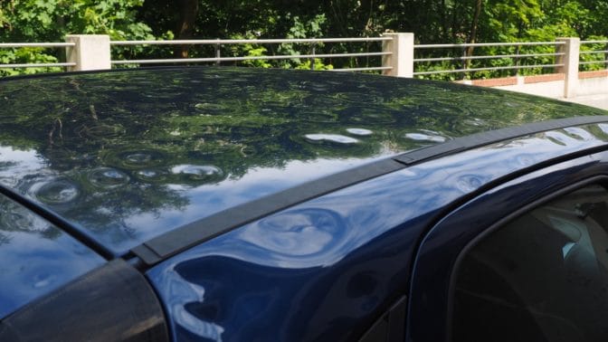 Hail damage to a car hood. By predicting hail more accurately, scientists hope to give people a chance to park their cars beyond the reach of storms.