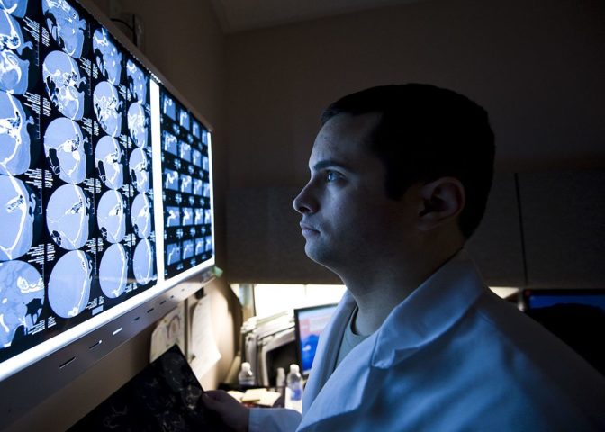 Here, a radiologist studies a CT scan from a patient with a traumatic brain injury, but many regions face a severe shortage of radiologists. Qure.ai's automated CT scan is designed to hep patients where radiologists are scarce.