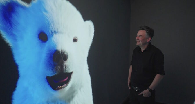 Harris and one of his artworks made using technologies from NVIDIA
