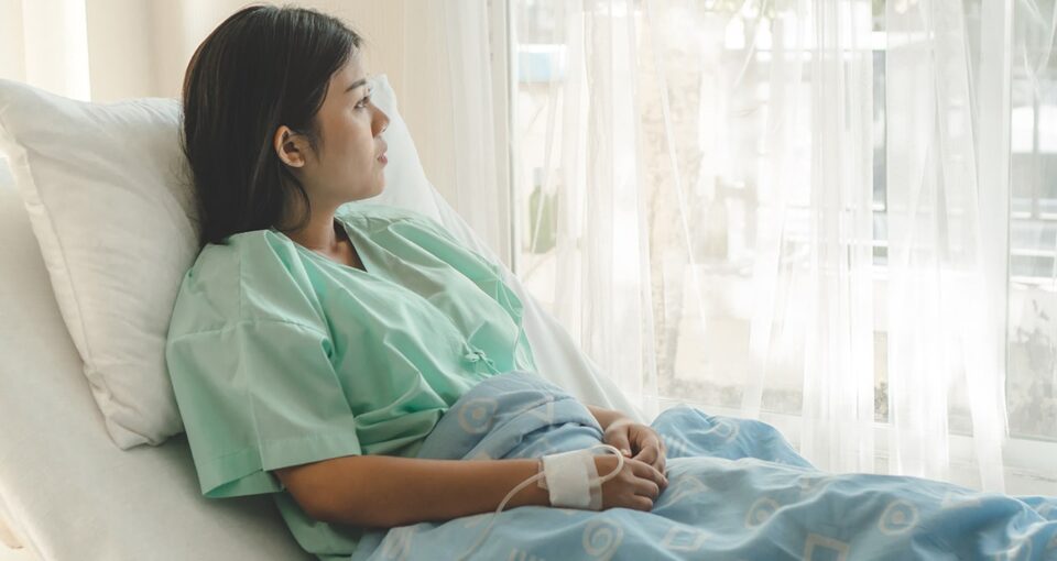 patient sitting in hospital bed