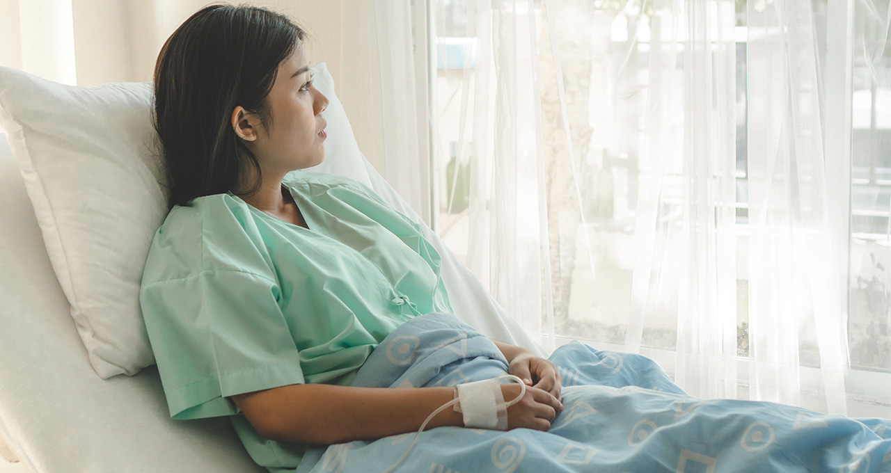 patient sitting in hospital bed