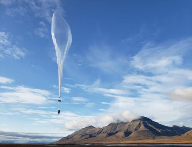 weather balloon against landscape