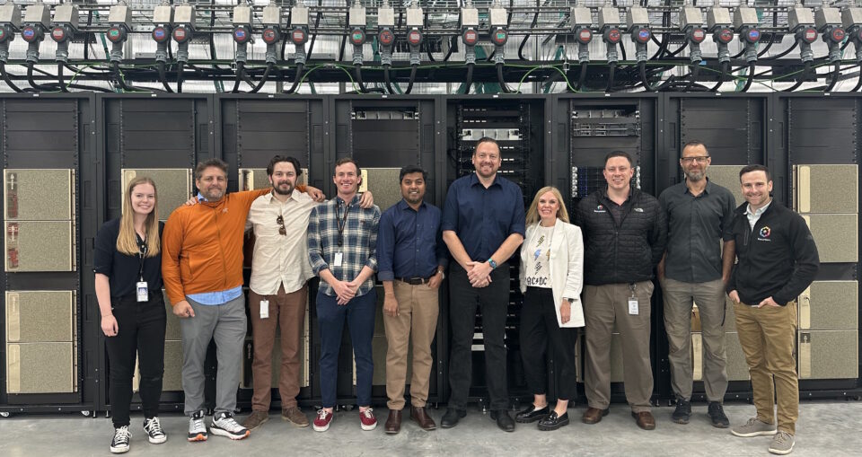 Picture of Recursion team with BioHive-2 AI supercomputer for drug discovery