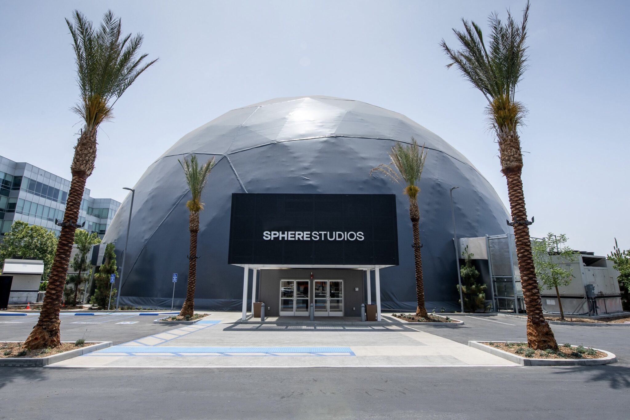 dome-shaped edifice flanked by palm trees