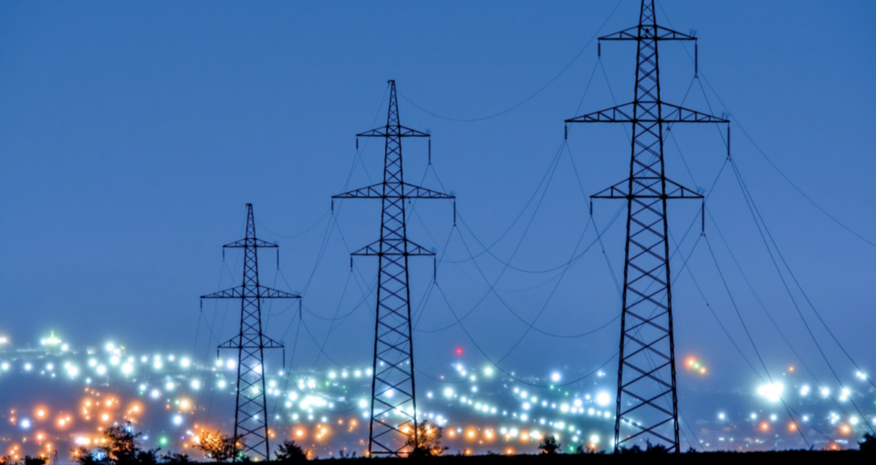 power lines against urban backdrop