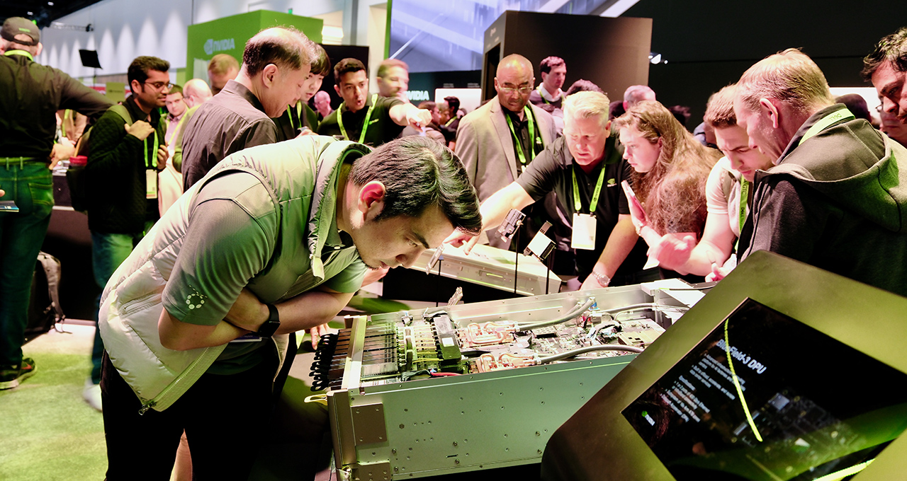 GTC attendee looking at hardware in the NVIDIA booth